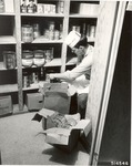 1310-514546 Corpsman Piatt Stocks Shelves Kitchen - Sam Houston National Forest 1966